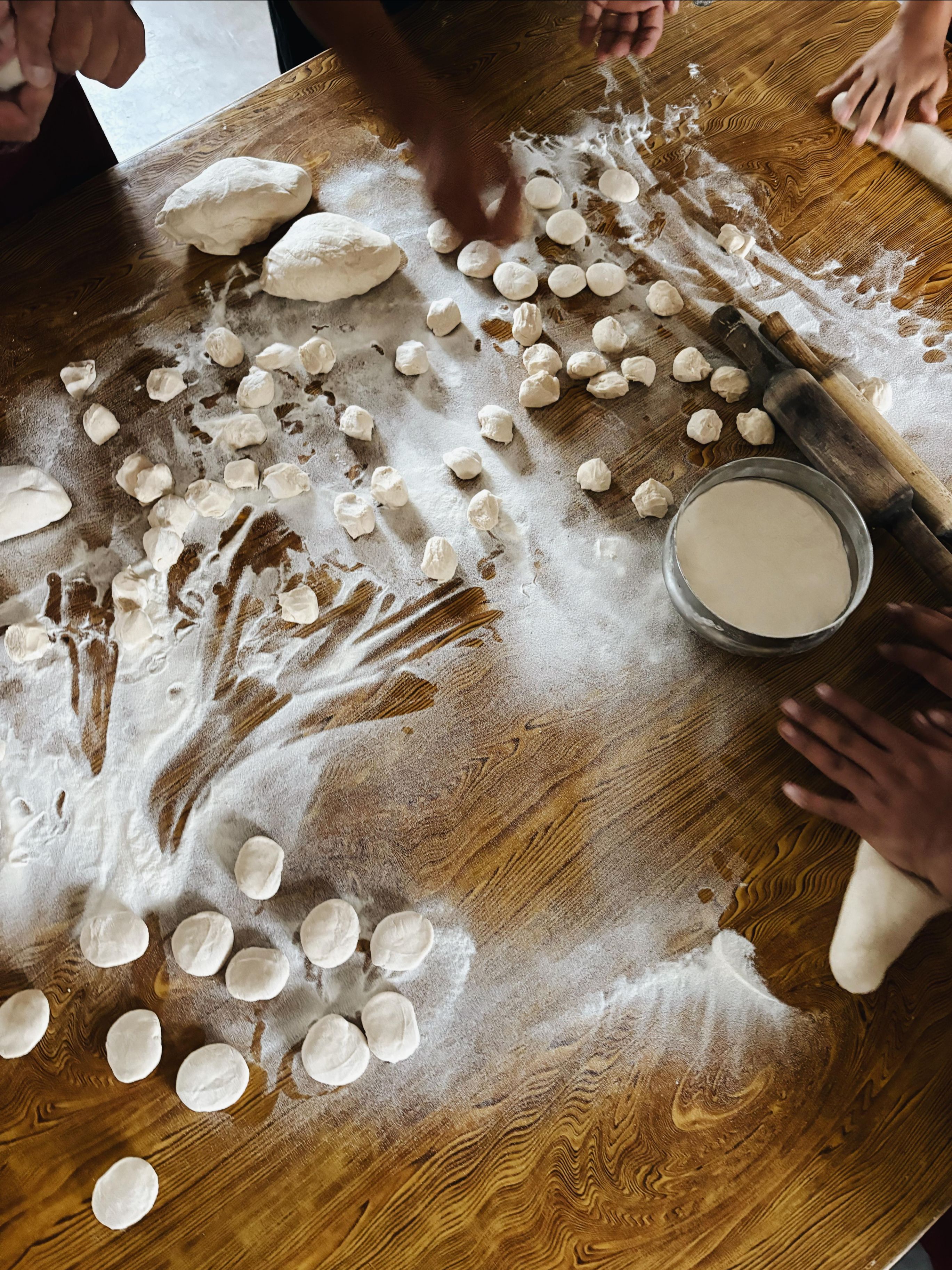 EDP students and teachers making momos together