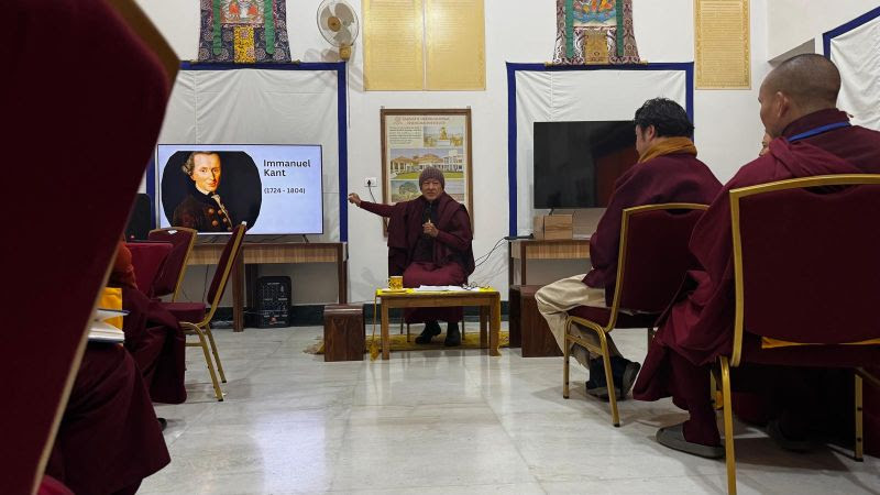 Monastics participating in group discussions during the training