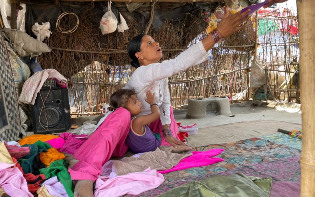 Woman receiving aid from SINI